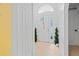 Bright foyer with white tiled floors, decorative plants, and a large front door with side windows at 971 Cascades Park Trl, Deland, FL 32720