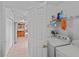 Laundry room is well-equipped and leads into the kitchen, simplifying household tasks at 971 Cascades Park Trl, Deland, FL 32720