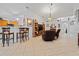 Open-concept living space with bar seating adjacent to the kitchen area at 971 Cascades Park Trl, Deland, FL 32720
