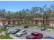 Convenient parking area near the Edgewater Condominiums buildings, surrounded by mature trees at 100 Sweetgum Woods Ct # 11D, Deltona, FL 32725