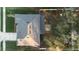 A high-angle view of the house showcasing the roof, backyard, and patio with fire pit at 1318 Pup Fish Ln, Deland, FL 32724