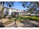 Exterior view of the home with a spacious backyard, landscaping and fenced yard at 1318 Pup Fish Ln, Deland, FL 32724