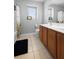 Bathroom featuring double vanity with white countertops and a shower-tub combination at 1318 Pup Fish Ln, Deland, FL 32724