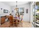 Cozy breakfast nook featuring a round table, chairs, and a large window at 1318 Pup Fish Ln, Deland, FL 32724