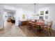 Elegant dining room with a wooden table, chandelier lighting, and decorative accents at 1318 Pup Fish Ln, Deland, FL 32724