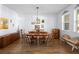 Cozy dining room with wood floors, natural light, and classic furniture at 1318 Pup Fish Ln, Deland, FL 32724