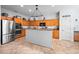 Modern kitchen with stainless steel appliances, a kitchen island, and tile flooring at 1318 Pup Fish Ln, Deland, FL 32724