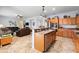 Kitchen with stainless steel appliances, tile floors, and connected living room at 1318 Pup Fish Ln, Deland, FL 32724