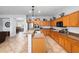 Open kitchen with tile floors and stainless steel appliances at 1318 Pup Fish Ln, Deland, FL 32724