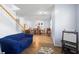Open concept living room with staircase, adjacent dining area, and comfortable seating at 1318 Pup Fish Ln, Deland, FL 32724