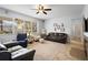 Bright living room with large windows, tile floors, and comfortable seating at 1318 Pup Fish Ln, Deland, FL 32724