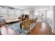 Open living space with hardwood floors, a decorative rug, a comfortable sofa, and large windows for natural light at 1318 Pup Fish Ln, Deland, FL 32724