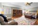 Spacious bedroom features hardwood floors, a tray ceiling, and ample natural light from the windows at 1318 Pup Fish Ln, Deland, FL 32724