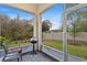 Enjoy the outdoors on this screened patio with a grill and a view of the manicured backyard at 1401 Brookdale Ct, Oviedo, FL 32765