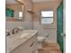 Bathroom featuring marble countertop vanity, white tile walls, and decorative shower curtain at 141 N Mcdonald Ave, Deland, FL 32724