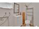 Bright bathroom featuring white tiles, modern fixtures and a clean aesthetic at 141 N Mcdonald Ave, Deland, FL 32724
