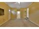 Bedroom features carpet flooring and access to other rooms at 141 N Mcdonald Ave, Deland, FL 32724