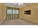 Bedroom features carpet flooring and a ceiling fan at 141 N Mcdonald Ave, Deland, FL 32724