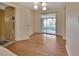 Dining area with hardwood floors and sliding glass doors to a screened-in porch at 141 N Mcdonald Ave, Deland, FL 32724