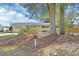 Traditional home with mature trees, dark shutters and a cozy, well-manicured front yard at 141 N Mcdonald Ave, Deland, FL 32724