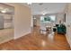 Hardwood floor living room featuring a ceiling fan and an exit to a backyard at 141 N Mcdonald Ave, Deland, FL 32724