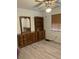 Cozy bedroom features wood-look flooring and a ceiling fan, creating a comfortable space at 1420 Felton St, Deltona, FL 32725