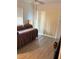 Bedroom with wood flooring, closet, and sliding glass doors allowing ample natural light at 1420 Felton St, Deltona, FL 32725
