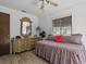 Comfortable bedroom with vintage dresser and window offering natural light at 1420 Felton St, Deltona, FL 32725