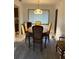 Traditional dining room featuring a wooden table with floral cushioned chairs and overhead light at 1420 Felton St, Deltona, FL 32725