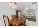 Traditional dining room featuring a china hutch, dining table, and decorative light fixture at 1420 Felton St, Deltona, FL 32725