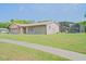 Charming single-story home with an attached garage, well-kept lawn, and screened-in pool at 1420 Felton St, Deltona, FL 32725