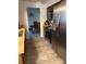Open kitchen view with stainless steel appliances and a glimpse into the dining area at 1420 Felton St, Deltona, FL 32725