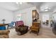 Cozy living room with bright laminate flooring, comfortable seating, and a dining area at 1420 Felton St, Deltona, FL 32725