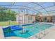 Screened pool with turquoise water, pool furniture, and well-maintained patio at 1420 Felton St, Deltona, FL 32725