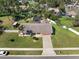 Charming single-story home features a pool, large yard, and extended driveway at 1489 Casey Ln, Port Orange, FL 32129