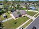 Aerial view of a residence with a screened-in pool, spacious yard, and mature trees at 1489 Casey Ln, Port Orange, FL 32129