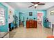 Hallway featuring bright walls, unique decor, and an open doorway to a bathroom with pink wallpaper at 1489 Casey Ln, Port Orange, FL 32129