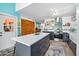 Updated kitchen features an island and stainless-steel appliances, with open shelving for displaying your favorite items at 1489 Casey Ln, Port Orange, FL 32129