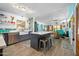 Bright kitchen with stainless steel appliances, island with seating, and open floor plan to the living area at 1489 Casey Ln, Port Orange, FL 32129
