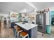 Spacious open kitchen with a large island, seating, stainless-steel appliances, and ample counter space at 1489 Casey Ln, Port Orange, FL 32129