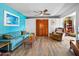 Comfortable living room featuring hardwood floors and a large blue sofa set at 1489 Casey Ln, Port Orange, FL 32129