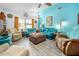Bright and spacious living area with ample seating, colorful decor, and large windows for natural light at 1489 Casey Ln, Port Orange, FL 32129