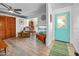 Cozy living room with wood-look flooring, comfortable seating, and a bright, inviting atmosphere at 1489 Casey Ln, Port Orange, FL 32129