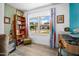 Small office space with a large window and ample storage space at 1489 Casey Ln, Port Orange, FL 32129