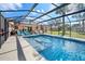 This screened-in pool has ample space for entertaining and relaxing with the spa jets to enjoy the afternoon at 1489 Casey Ln, Port Orange, FL 32129