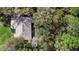 Aerial perspective showcases home nestled among lush trees, offering a secluded, private retreat at 1552 Covered Bridge Dr, Deland, FL 32724