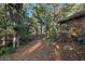 Natural backyard with mature trees providing privacy at 1552 Covered Bridge Dr, Deland, FL 32724