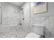 Contemporary shower with tiled walls, a shower head, and a built-in bench at 1552 Covered Bridge Dr, Deland, FL 32724