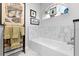 Bathroom featuring a tub, tiled walls, and an ornate window at 1552 Covered Bridge Dr, Deland, FL 32724