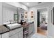 Bathroom showcasing dual sinks, modern fixtures, and doorway to main bedroom at 1552 Covered Bridge Dr, Deland, FL 32724